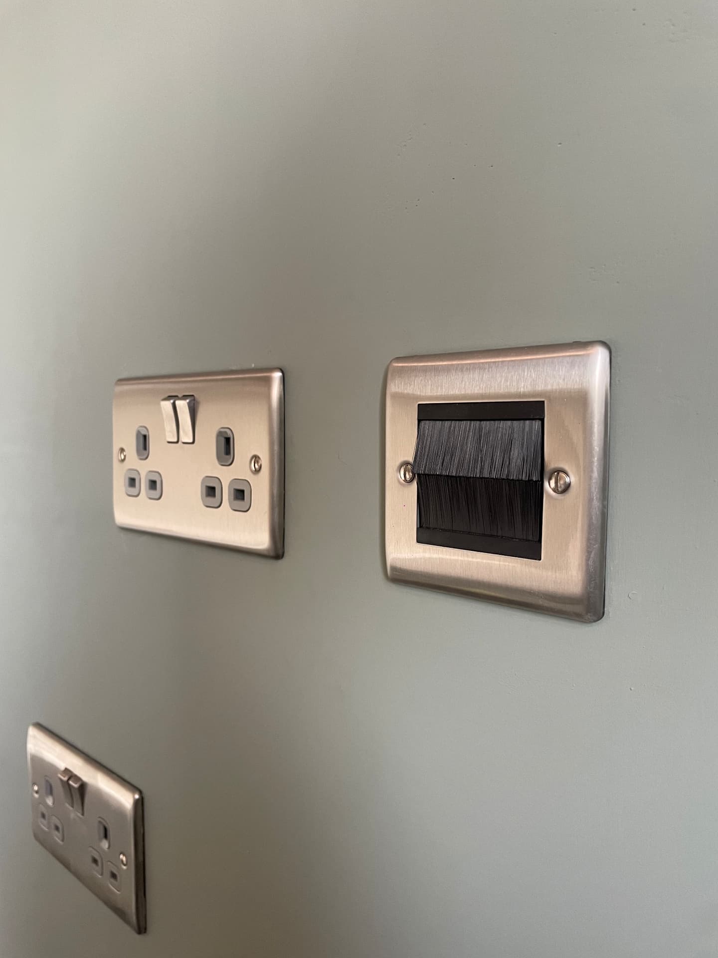 Brushed chrome double sockets and brush data plate installed in a Southampton home